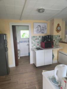 a kitchen with a sink and a counter top at Studio chez Fred et Angela in Saint-Dizier