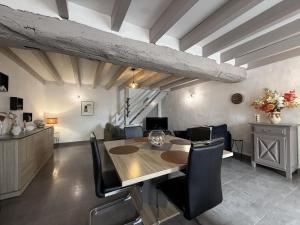 a dining room with a table and some chairs at Axuri-alde in Sare