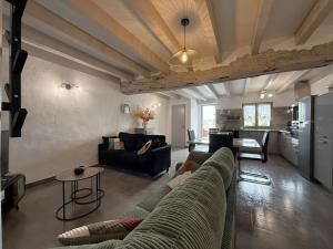 a living room with a couch and a table at Axuri-alde in Sare