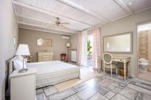 a bedroom with a large bed and a desk at Corinthian Blue Retreat in Katakoúli +126 photos