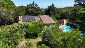 an aerial view of a house with solar panels on its roof at Villa La Marpierre in Mondragon