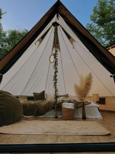 a tent with a bed in the middle at Debed Glamping in Debed