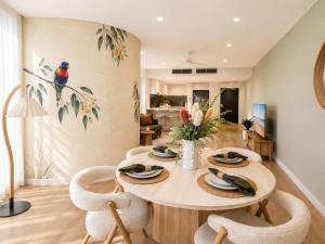 a dining room with a table and chairs at Koala Sky Suite River & City Views in Brisbane