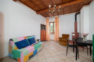 a living room with a couch and a table at Autenticum Agriturismo Tolfa in Tolfa +64 photos