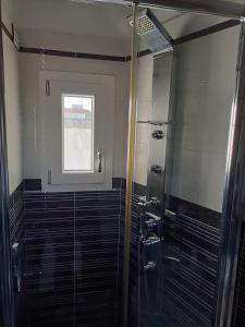 a bathroom with a shower and a window at La RIVISTA in Manduria +16 photos