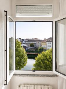a window with a view of a city at Hotel Santa Clara in Monforte de Lemos
