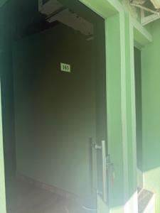a bathroom with a door with a sign on it at Flat mobiliado centro formosa Go in Formosa