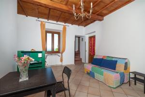 a living room with a couch and a table at Autenticum Agriturismo Tolfa in Tolfa