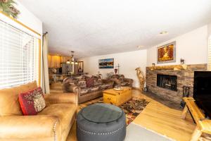 a living room with a couch and a fireplace at Willows #1704 in Keystone