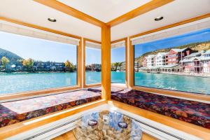 a room with two windows and a table at Willows #1704 in Keystone