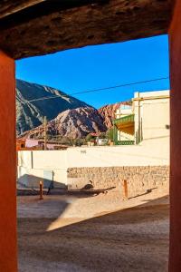 a view of a building with mountains in the background at hospedaje chango luna in Purmamarca