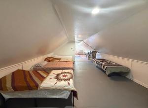 a row of beds in a small room at Leapin leanas in Monson