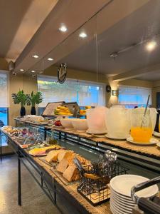 a buffet line with many different types of food at Hotel Hernandarias in Santa Fe