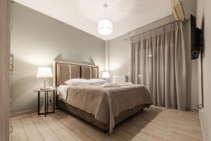 เตียงในห้องที่ Volos Comfort Space