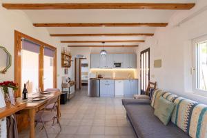 a kitchen and living room with a couch and a table at Apartament in Monte Pedreguer in Pedreguer
