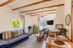 a living room with a couch and a table at Apartament in Monte Pedreguer in Pedreguer