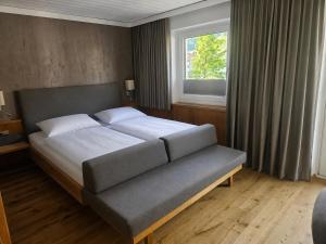 a bedroom with a bed and a window at Appartement Maria Leiter in Sillian