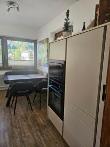 a small kitchen with a table and a microwave at Appartement Maria Leiter in Sillian