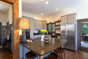 a kitchen with a large island with a counter top at Evergreen Cottage in Blowing Rock