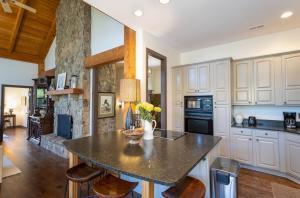 a kitchen with a large island in the middle at Evergreen Cottage in Blowing Rock