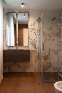 a bathroom with a sink and a mirror at Fill's Luxury Design Apartments 100m from the Beach in Rimini +142 photos