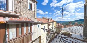 a view from the balcony of a building with a view at Borgo Tibetano in Castelsaraceno