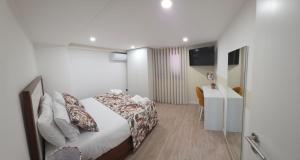 a hotel room with a bed and a desk at Casa Sobreira de Mondim in Mondim de Basto