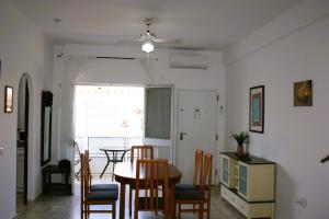 a kitchen and dining room with a table and chairs at Calm Bungalow in Torrox