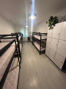 a room with three bunk beds in a room at Хостел Мануфактура in Kharkiv