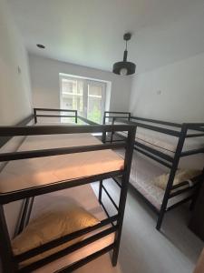 two bunk beds in a room with a window at Хостел Мануфактура in Kharkiv