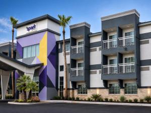 a rendering of the exterior of a building with palm trees at Spark by Hilton Tempe Phoenix Airport in Tempe