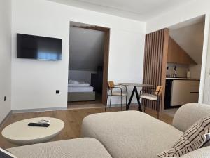 a living room with a couch and a table at SmartStay Johnny in Podstrana
