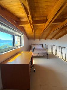 a room with a desk and a bed and a window at Elements Villas in Paleros +131 photos