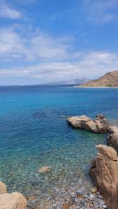 a large body of water with rocks in it at Baba Houlakia in Houlakia