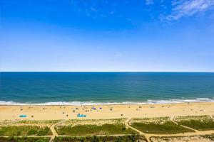 an aerial view of a beach with people at Carousel 1904 in Ocean City