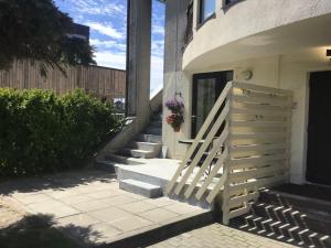 a set of stairs leading up to a house at Studio Flat by the sea in Melnragė
