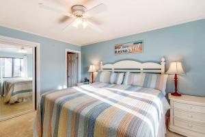 a bedroom with a bed and a ceiling fan at Our Place At The Beach 206B in Ocean City +6 photos