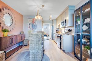 a kitchen with a table and a dining room at Boho Bayshore 42 in Ocean City +19 photos