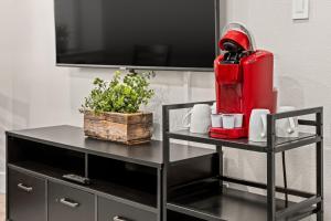 a black table with a red fire hydrant on it at Aisling Suites in Great Falls