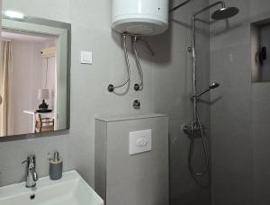 a bathroom with a shower and a sink at Vele House Walk to Beach in Herceg-Novi +56 photos