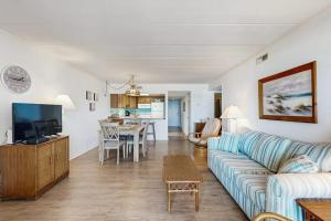 a living room with a couch and a table at Purnell House 402 in Ocean City