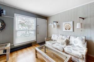 a living room with a couch and a window at Gullway Getaway in Ocean City