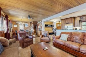 a living room with a couch and a table at WeSeekANook in Meredith