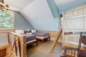 a bedroom with a bunk bed and a ladder at WeSeekANook in Meredith
