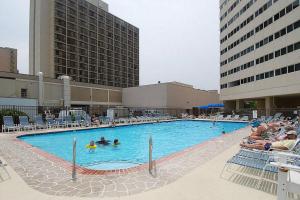 a large swimming pool with people in a hotel at Atlantis 502 in Ocean City
