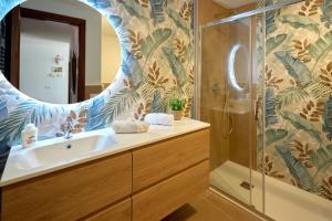 a bathroom with a sink and a shower at The Lemon Garden Escape in Meta +37 photos