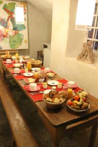 a table with many plates of food on it at La Haute Flourie - bed and breakfast -chambres d'hôtes in Saint Malo