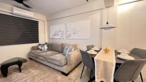 a living room with a couch and a table at CHL Pod in General Trias