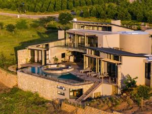 an aerial view of a house with a swimming pool at Izakithi River Villa in Malelane
