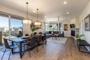 a dining room and living room with a table and chairs at Sail Lofts #301 in Dillon
